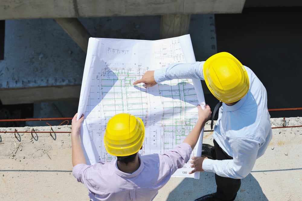 workers-at-a-jobsite-viewing-blueprint