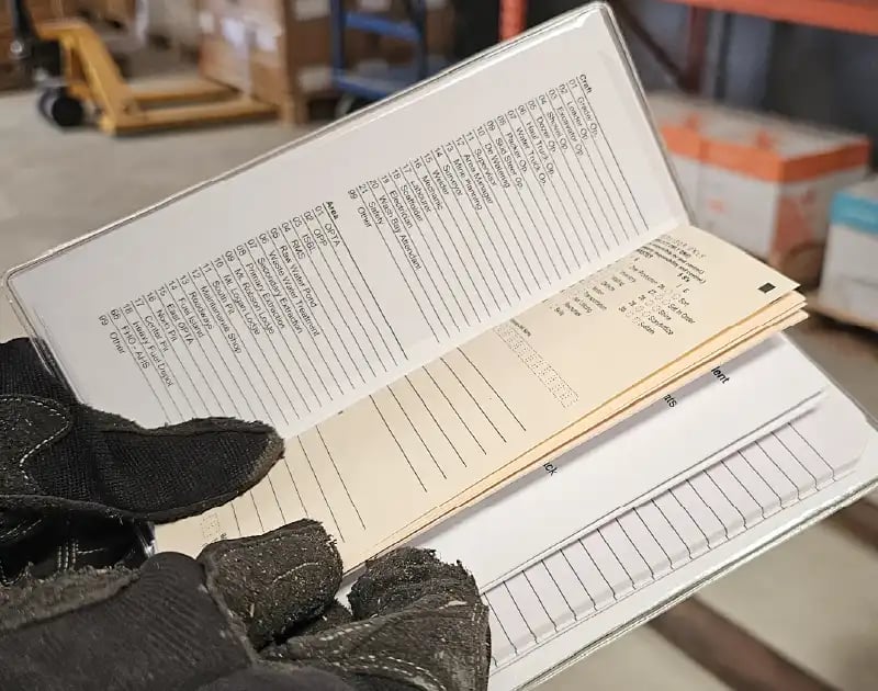worker-viewing-tally-book-inserts worker-viewing-tally-book-inserts
