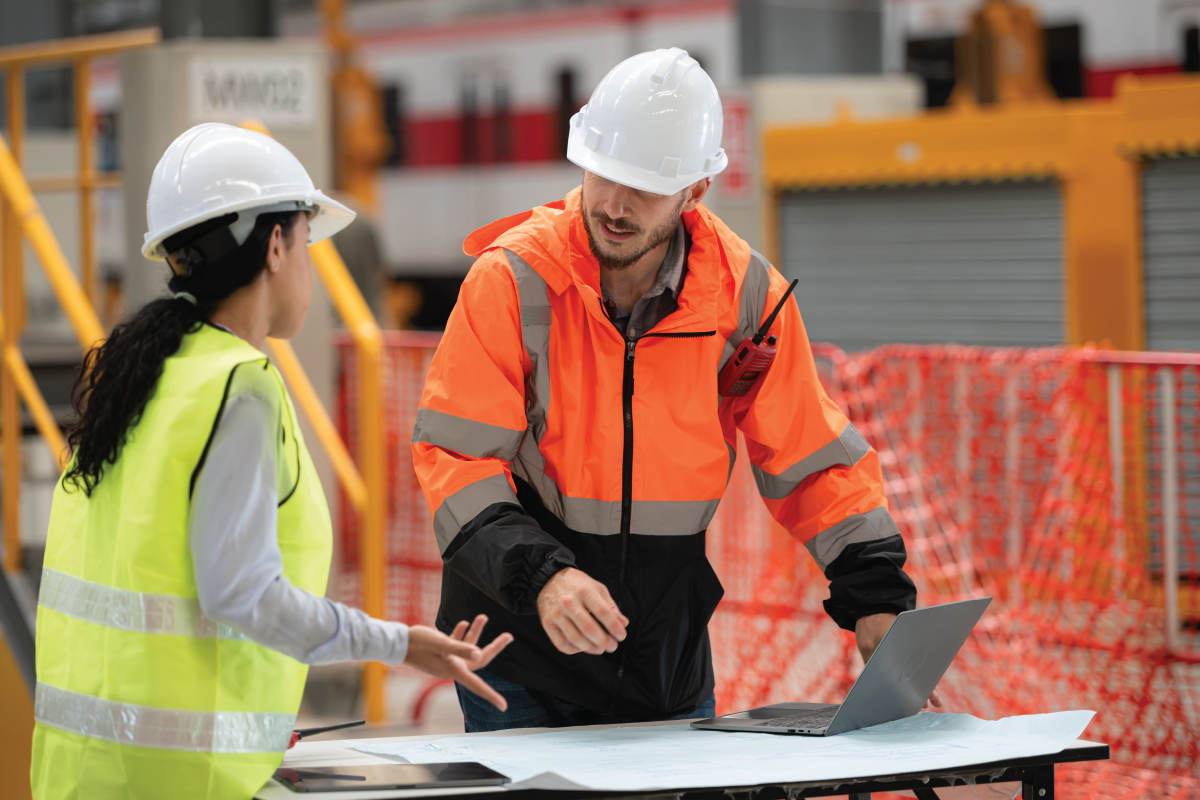 man-and-woman-engineers-discussing-project
