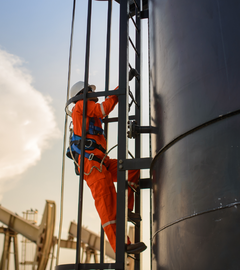 man-working-climbing-oil-tank man-working-climbing-oil-tank