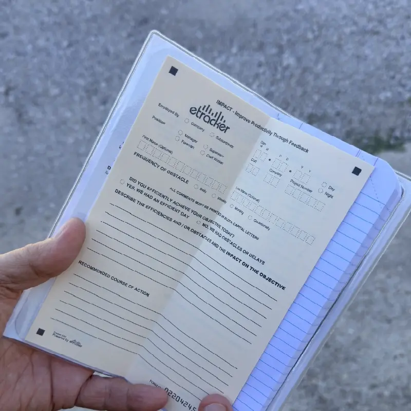 worker-holding-open-oilfield-tally-book